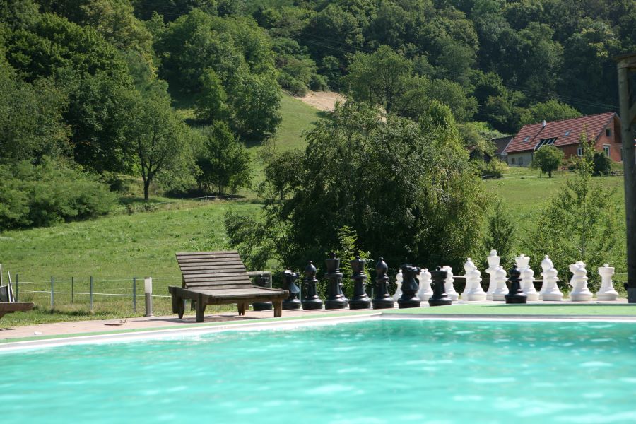 image of Tree-Hotel pool area with giant chess